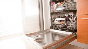 A dishwasher owned by someone who is wondering, "Why is my dishwasher leaking?"